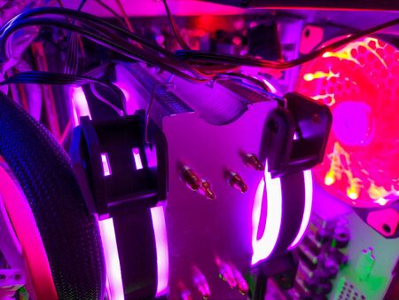 Modern computer air cooling with multi-colored led backlight-fans, cooling radiators, cables, boards, close-up.の写真素材