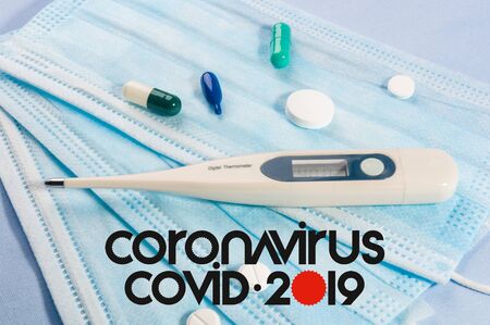 Background for news about the novel coronavirus COVID-19 - protective medical masks, thermometer and text Coronavirus COVID-19. Chinese coronavirus outbreak, Middle East respiratory syndrome coronavirus.の写真素材