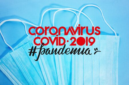 Background concept for news about the novel coronavirus COVID-19 pandemic, antiviral medical mask for protection against coronavirus. Surgical protective mask. Medical respiratory bandage face and thermometer, lettering on copy space.の写真素材