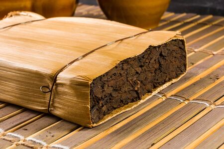 Chinese pressed PU-erh tea in bamboo leaf packaging, close-up