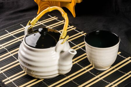 Traditional tea accessories on a bamboo Mat, close-upの写真素材