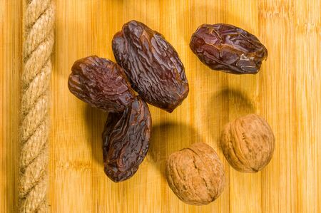 Big luxury dried date fruit on the wooden board, kurma ramadan kareem concept.の写真素材