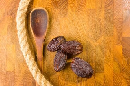 Big luxury dried date fruit on the wooden board, kurma ramadan kareem concept.の写真素材