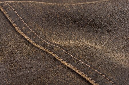 clothing items washed cotton fabric texture with seams, clasps, buttons and rivets, macro, close-upの写真素材