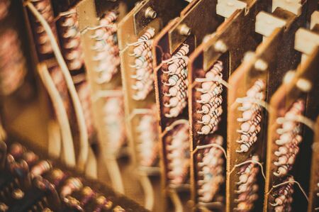 Vintage electronic circuit boards with radio parts and chips, close-up, macro photographyの写真素材