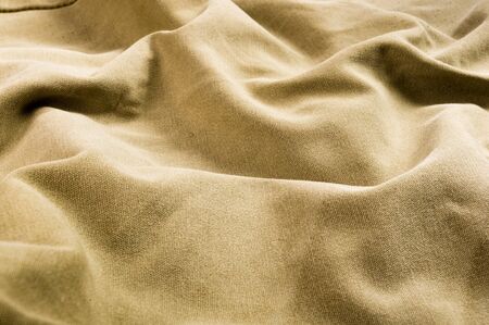 clothing items washed cotton fabric texture with seams, clasps, buttons and rivets, macro, close-upの写真素材