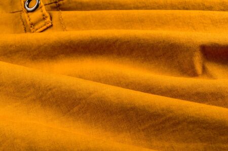 clothing items washed cotton fabric texture with seams, clasps, buttons and rivets, macro, close-upの写真素材