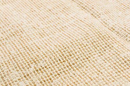 texture of light rustic coarse canvas fabric, close-up, backgroundの写真素材