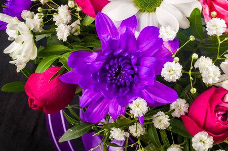 Background for a greeting card - beautiful gift bouquet of various blooming bright colorful decorative summer flowersの写真素材