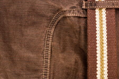 clothing items washed cotton fabric texture with seams, clasps, buttons and rivets, macro, close-upの写真素材