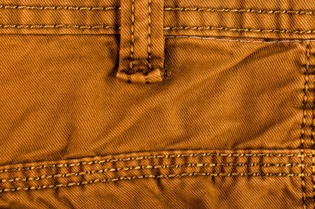 clothing items washed cotton fabric texture with seams, clasps, buttons and rivets, macro, close-upの写真素材