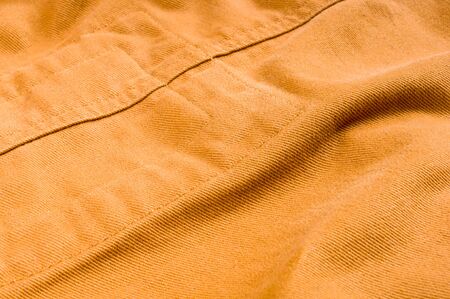 clothing items washed cotton fabric texture with seams, clasps, buttons and rivets, macro, close-upの写真素材