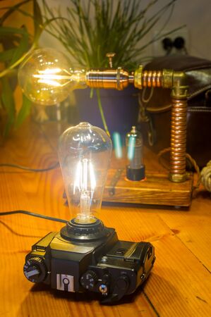 Light fixtures handmade in vintage style, retro film SLR camera case and wooden case, led lampsの写真素材