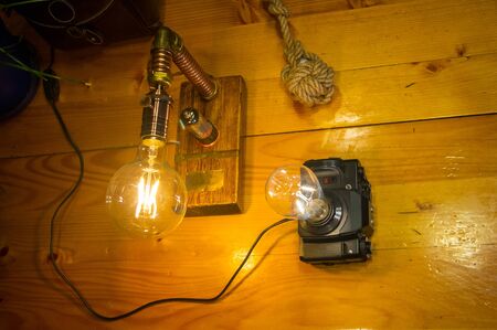 Light fixtures handmade in vintage style, retro film SLR camera case and wooden case, led lampsの写真素材
