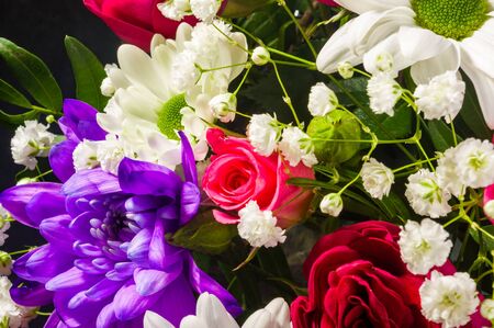 Background for a greeting card - beautiful gift bouquet of various blooming bright colorful decorative summer flowersの写真素材