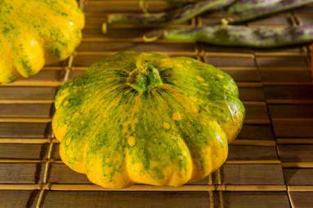 Still life - small spotted squash, asparagus beans, purple Basil, paprika on bamboo Matの写真素材