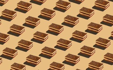 Trendy seamless food pattern - layered sponge cakes on a pastel background, minimal food isometric concept texture.の写真素材