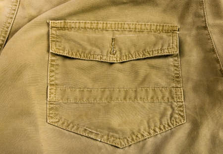 clothing items washed cotton fabric texture with seams, clasps, buttons and rivets, macro, close-upの写真素材
