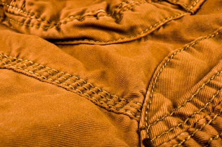 clothing items washed cotton fabric texture with seams, clasps, buttons and rivets, macro, close-upの写真素材