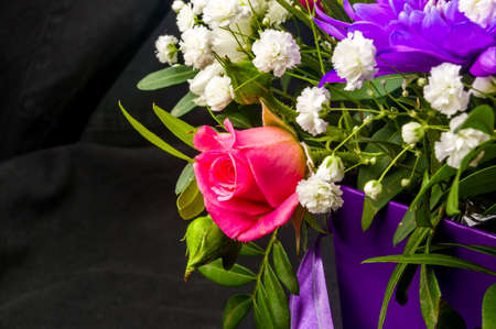 Background for a greeting card - beautiful gift bouquet of various blooming bright colorful decorative summer flowersの写真素材