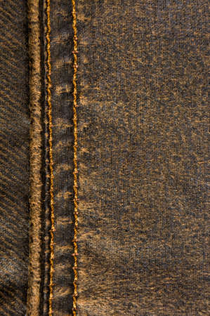clothing items washed cotton fabric texture with seams, clasps, buttons and rivets, macro, close-upの写真素材