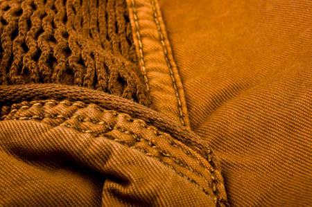 clothing items washed cotton fabric texture with seams, clasps, buttons and rivets, macro, close-upの写真素材