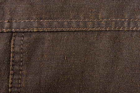 clothing items washed cotton fabric texture with seams, clasps, buttons and rivets, macro, close-up