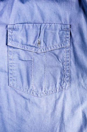 clothing items washed cotton fabric texture with seams, clasps, buttons and rivets, macro, close-upの写真素材