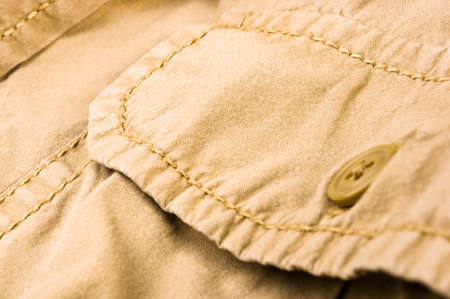 clothing items washed cotton fabric texture with seams, clasps, buttons and rivets, macro, close-upの写真素材