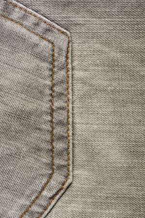 clothing items washed cotton fabric texture with seams, clasps, buttons and rivets, macro, close-upの写真素材