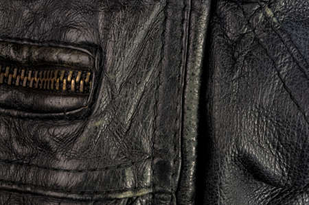 Old vintage genuine soft black leather texture background, top layer with pores and scratches, macroの写真素材
