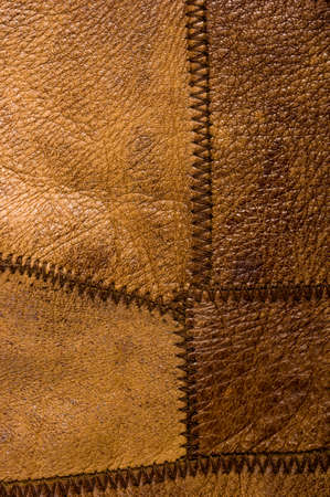 Old vintage genuine soft brown leather texture background, top layer with pores and scratches, macro