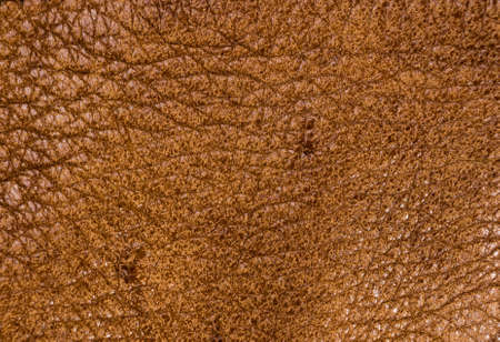 Old vintage genuine soft brown leather texture background, top layer with pores and scratches, macroの写真素材