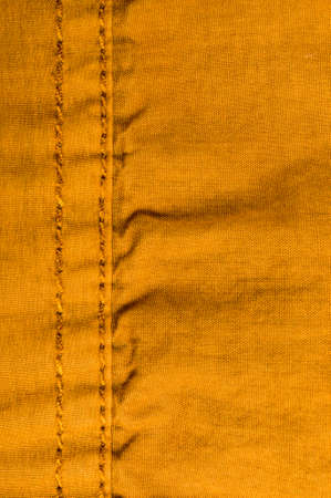 clothing items washed cotton fabric texture with seams, clasps, buttons and rivets, macro, close-upの写真素材