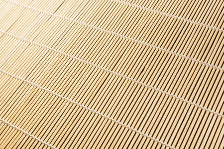 brown bamboo Mat - stand food, close-up, macro, black backgroundの写真素材