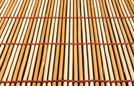 brown bamboo Mat - stand food, close-up, macro, black backgroundの写真素材