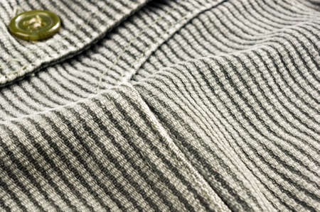 clothing items washed cotton fabric texture with seams, clasps, buttons and rivets, macro, close-up