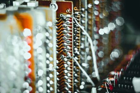 Vintage electronic circuit boards with radio parts and chips, close-up, macro photographyの写真素材