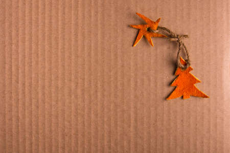 New Year Concept. Christmas decorations hand made from tangerine peel on cardboard backgroundの写真素材