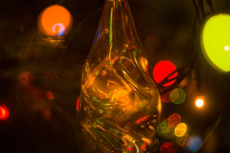Christmas background-garlands with colorful lights on a decorated Christmas tree, bokeh, close-upの写真素材