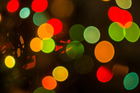 Christmas background-garlands with colorful lights on a decorated Christmas tree, bokeh, close-upの写真素材