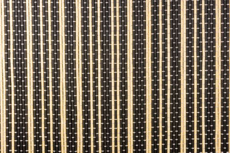 brown bamboo Mat - stand food, close-up, macro, black backgroundの写真素材