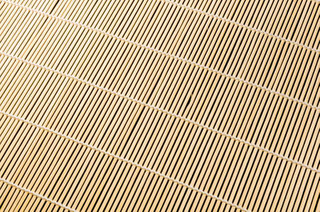 brown bamboo Mat - stand food, close-up, macro, black backgroundの写真素材