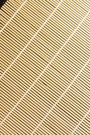 brown bamboo Mat - stand food, close-up, macro, black backgroundの写真素材