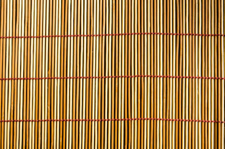 brown bamboo Mat - stand food, close-up, macro, black backgroundの写真素材