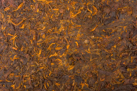 Chinese pressed PU-erh tea on wrapping paper, close-upの写真素材