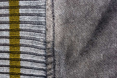 clothing items washed cotton fabric texture with seams, clasps, buttons and rivets, macro, close-upの写真素材
