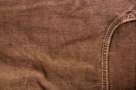 clothing items washed cotton fabric texture with seams, clasps, buttons and rivets, macro, close-up