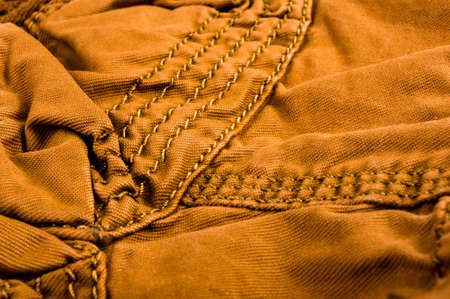 clothing items washed cotton fabric texture with seams, clasps, buttons and rivets, macro, close-upの写真素材