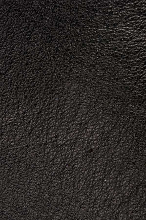 Old vintage genuine soft black leather texture background, top layer with pores and scratches, macroの写真素材